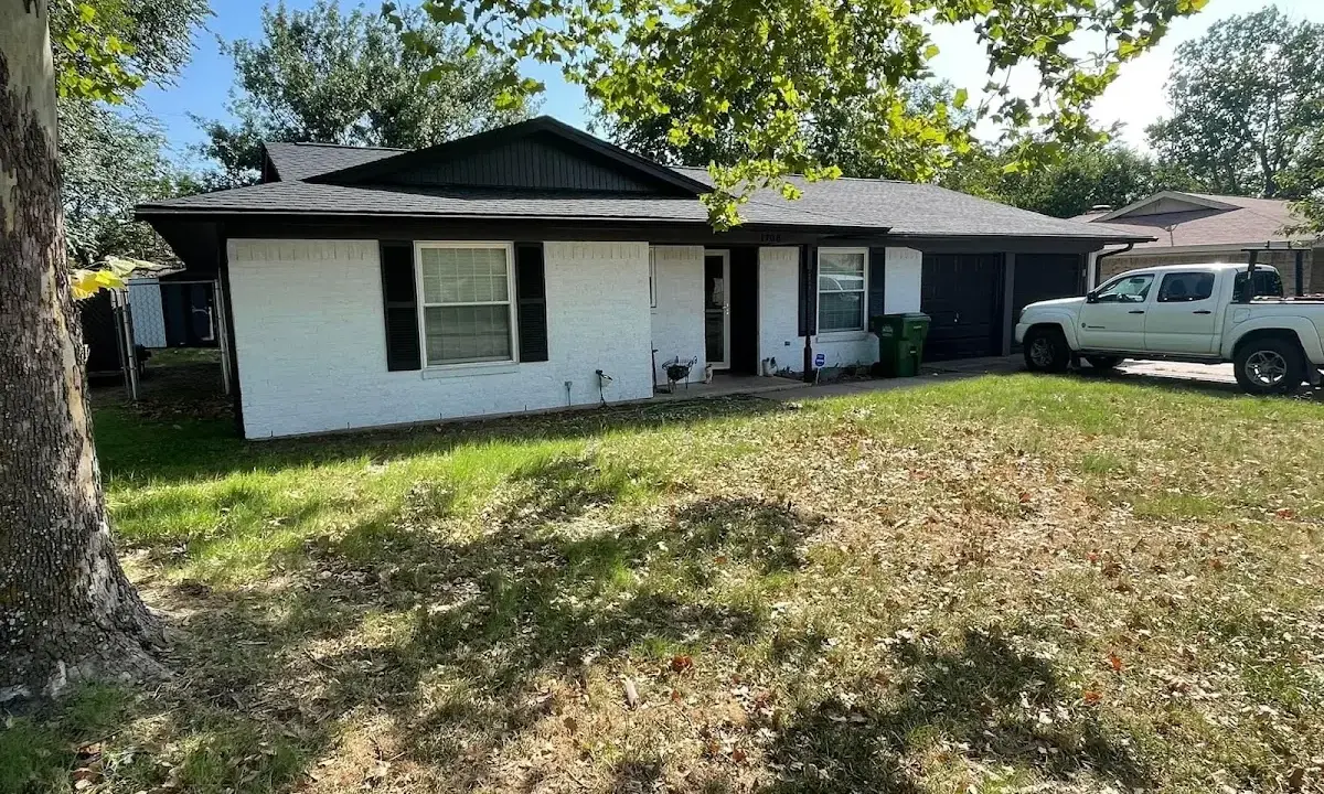 Professional roofing crew working on a residential roof in Herrin